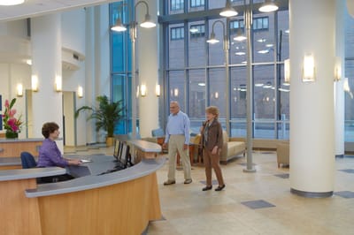Reception area with staff and residents interacting