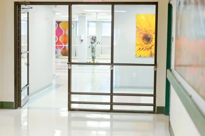 Bright corridor in a senior care facility with artwork