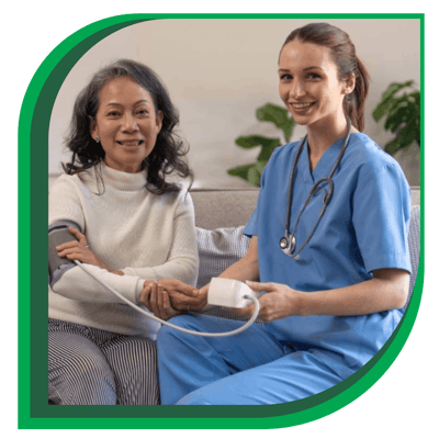 Healthcare staff assisting a resident with a check-up