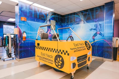 Therapy room with a colorful therapy vehicle