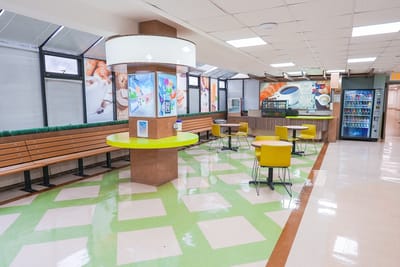 Bright common area with seating and refreshments