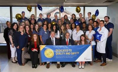 Staff and residents celebrating quality and safety achievement