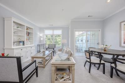 Bright common area with seating and dining space