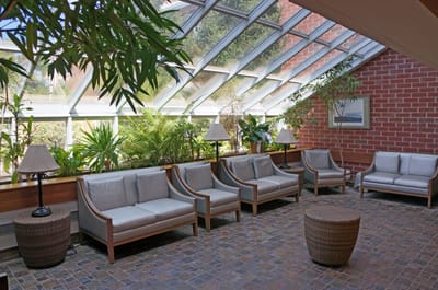 Bright common area with seating and plants