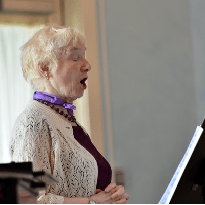 Resident singing during an activity in common area