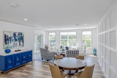 Bright common area with comfortable seating and artwork