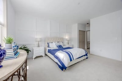 Bright, furnished bedroom in a senior living facility
