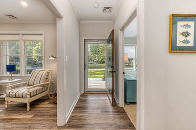 Interior hallway leading to a garden view