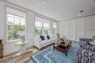 Bright common area with comfortable seating and decor