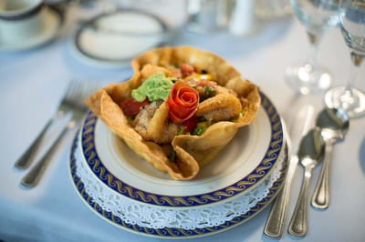 Gourmet meal presented in a decorative bowl