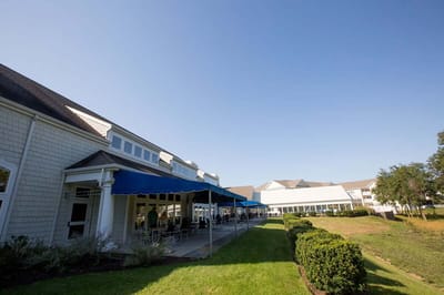 Exterior view of the facility with outdoor seating area
