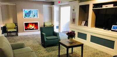 Bright common area with a fireplace and seating