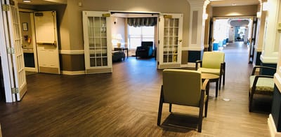 Bright common area with seating and natural light