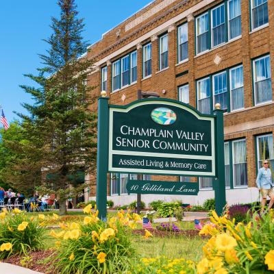 Signage for Champlain Valley Senior Community with gardens