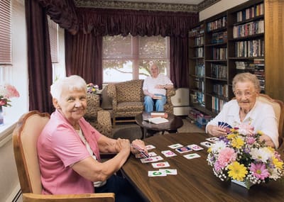 Residents playing cards in a common area
