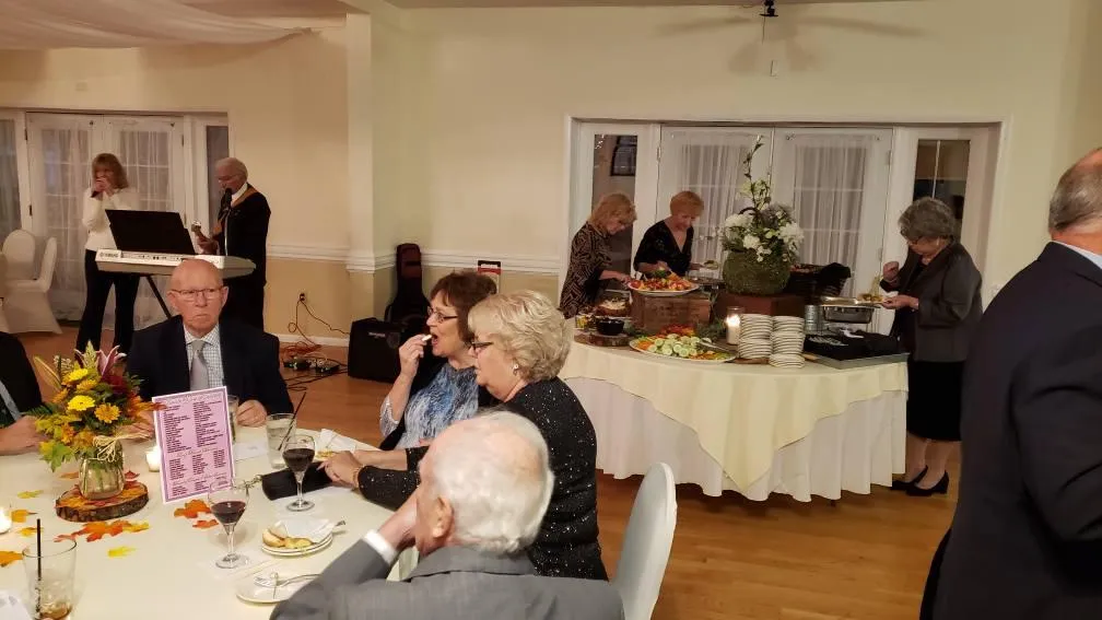 Residents enjoying a festive meal and socializing
