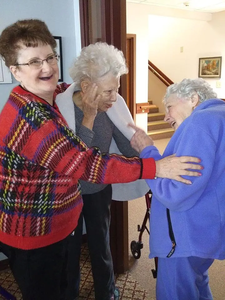 Residents enjoying a warm moment together in the facility