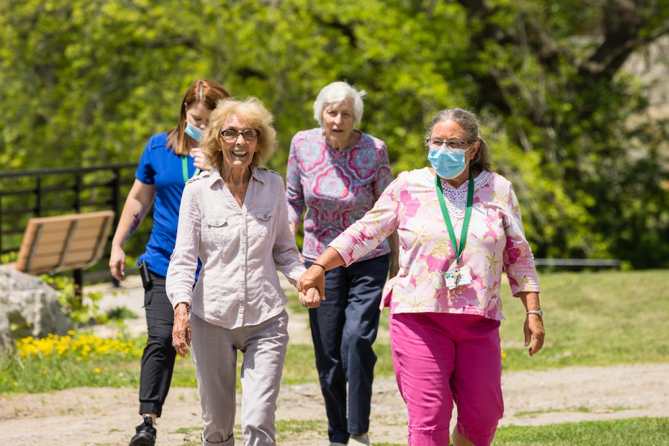 Residents enjoying a walk in a garden area