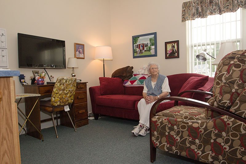 A woman sitting in a cozy living room