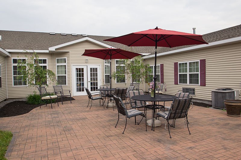 Outdoor patio area with seating and umbrellas