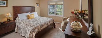 Cozy bedroom with floral decor and natural light
