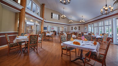 Dining room with tables set for residents