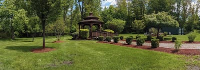 Gazebo in a serene outdoor space with green landscaping