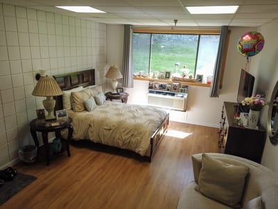 Cozy resident room with bed and decorations