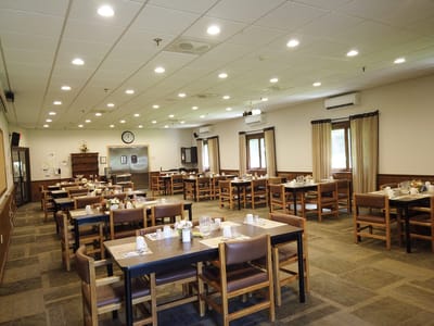 Dining room with tables set for mealtime