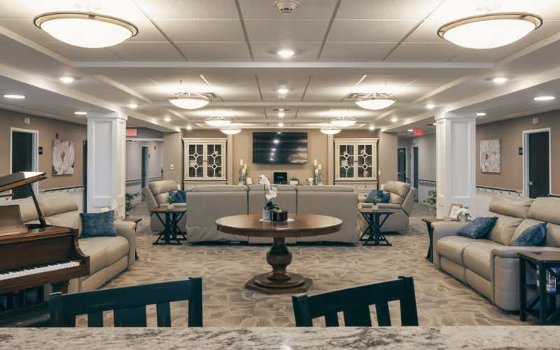 Common area with comfortable seating and piano