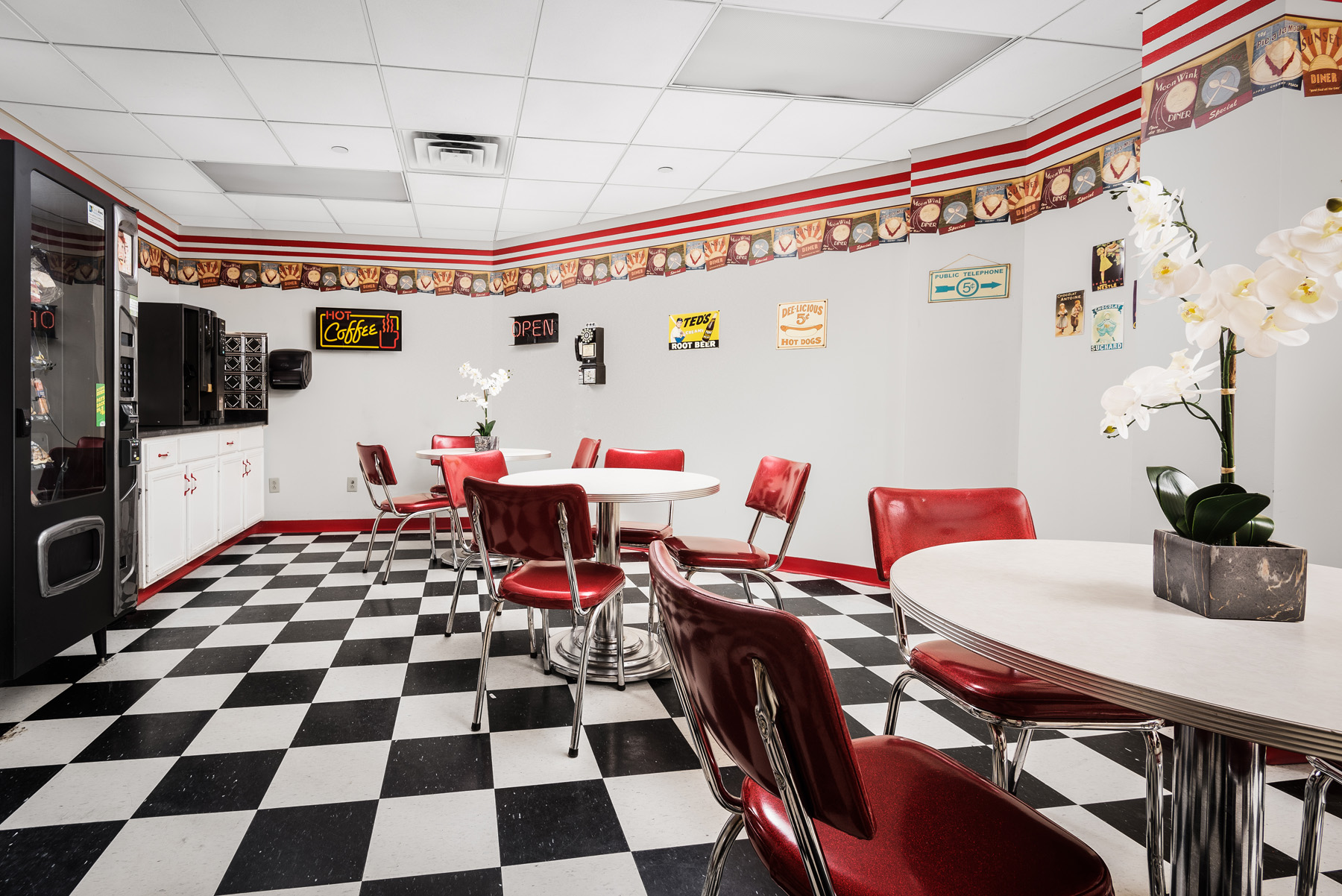 Bright dining room area with retro decor and tables