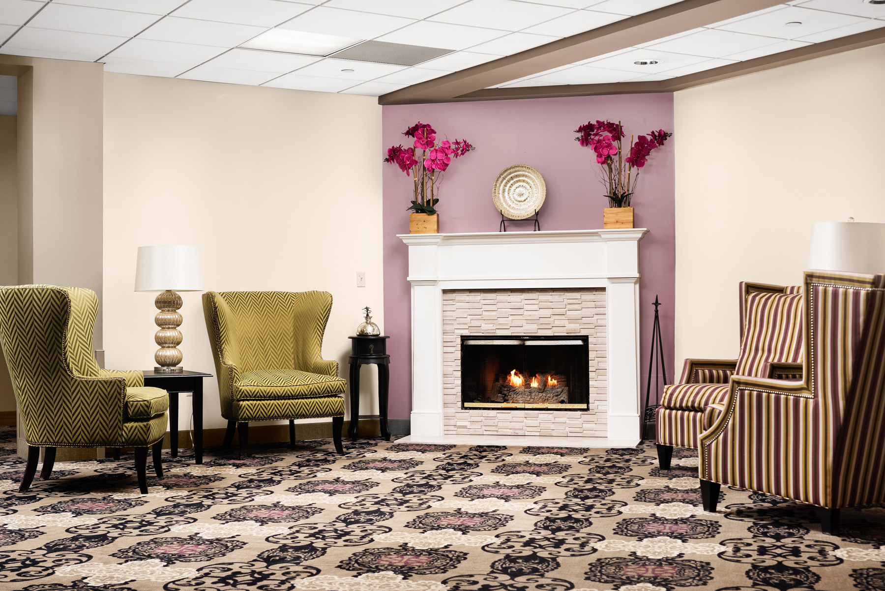 Cozy lounge area with fireplace and floral decor