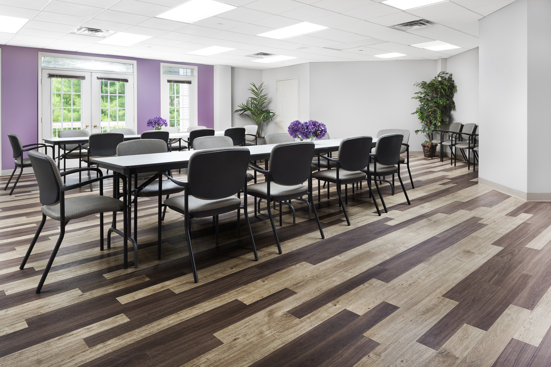 Bright common area with chairs and tables