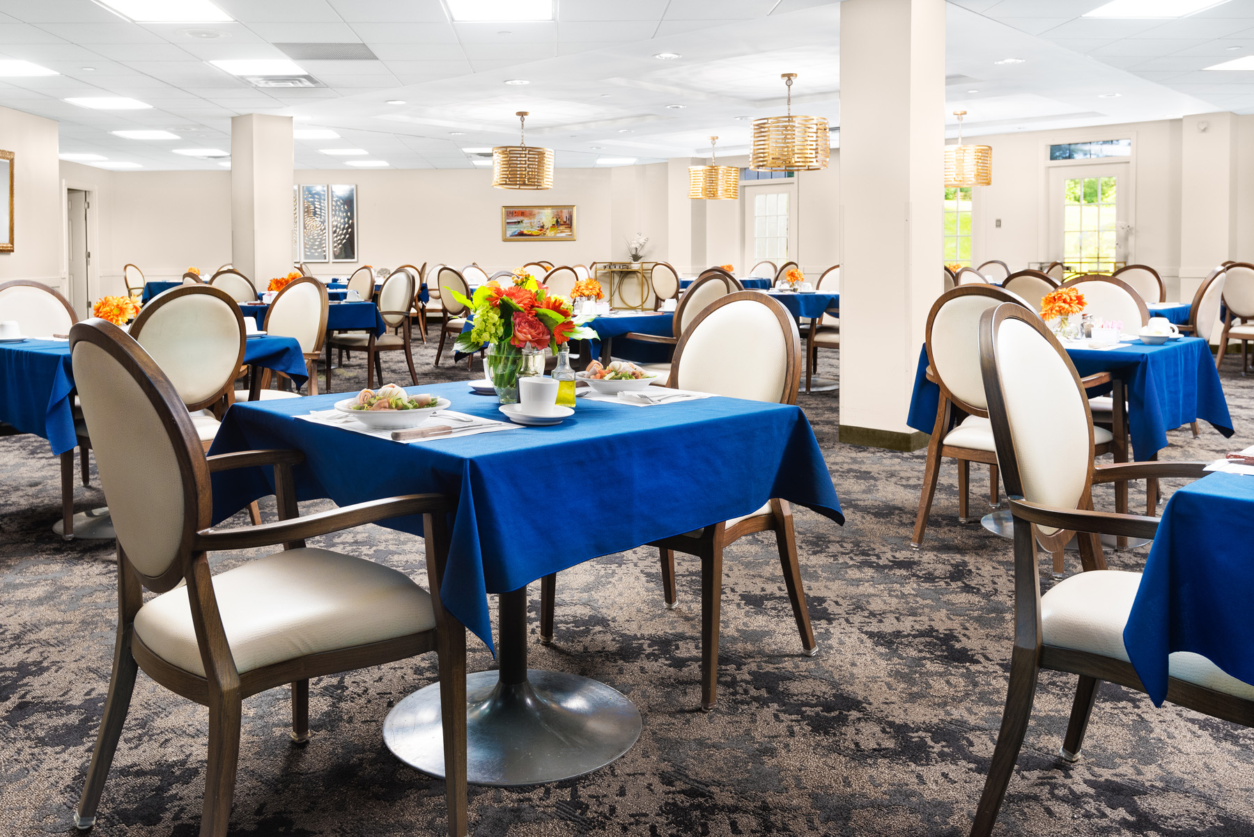 Dining room with tables set for a meal