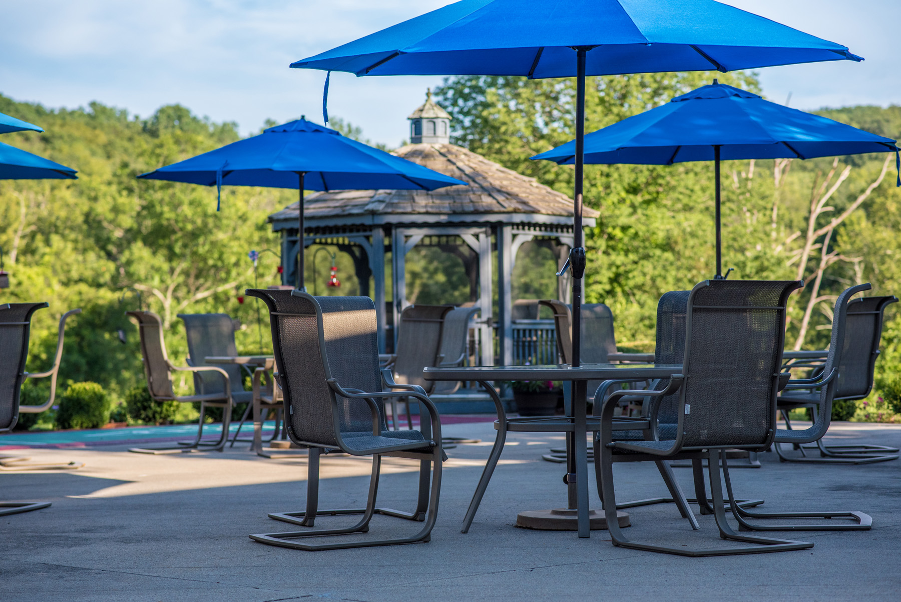 Outdoor seating area with umbrellas and gazebo