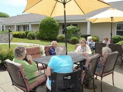 Residents enjoying a sunny outdoor space