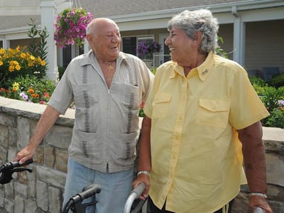 Two residents enjoying time outdoors in a garden