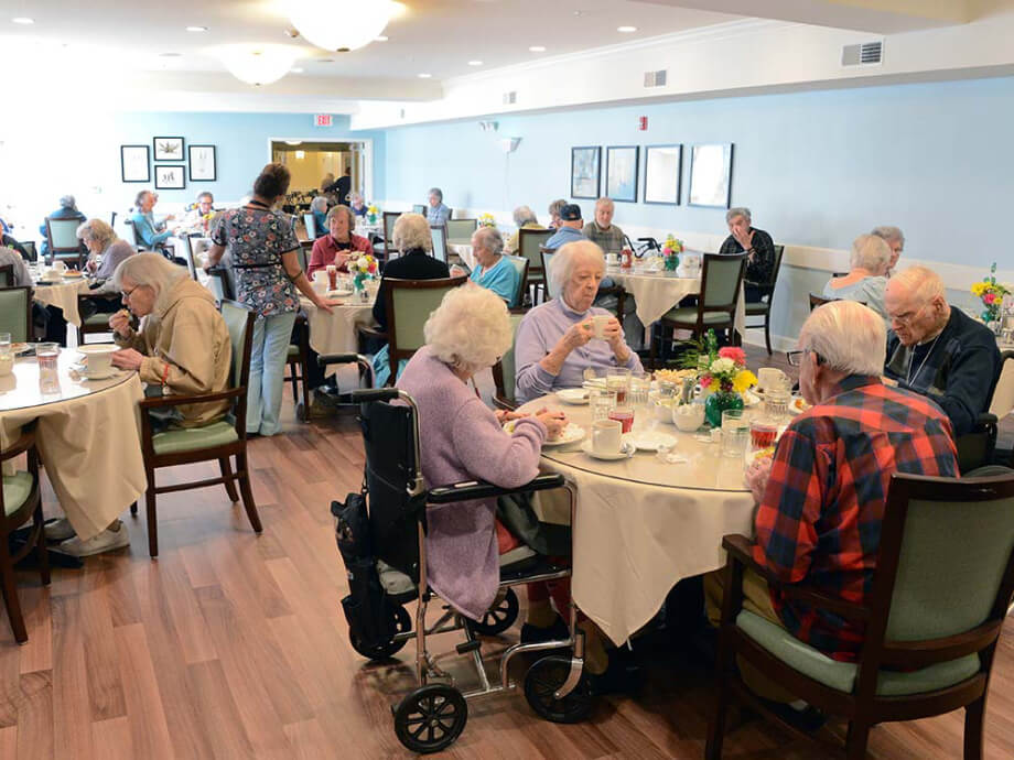 Residents enjoying a meal in the dining room