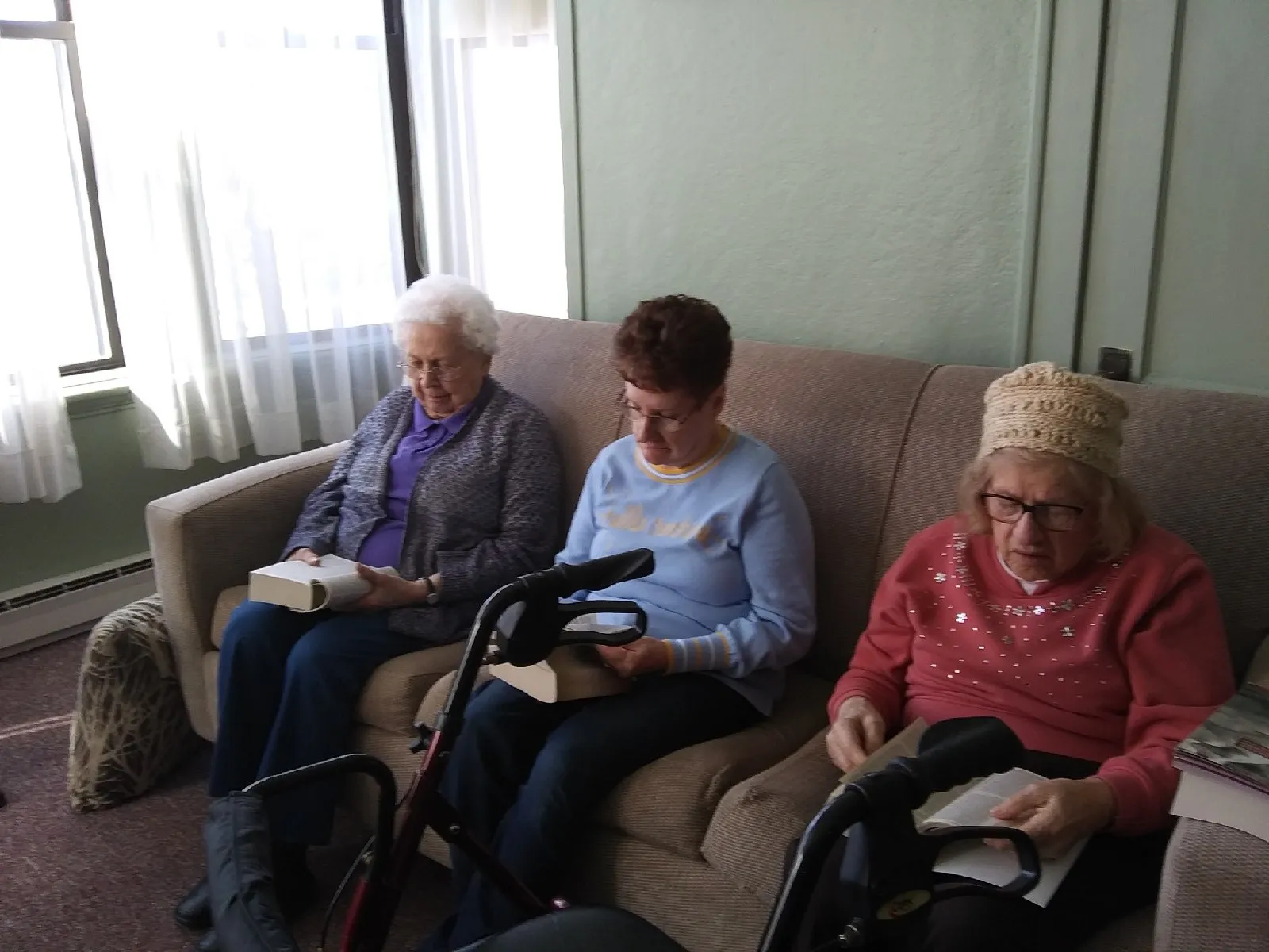Residents reading in a cozy lounge area