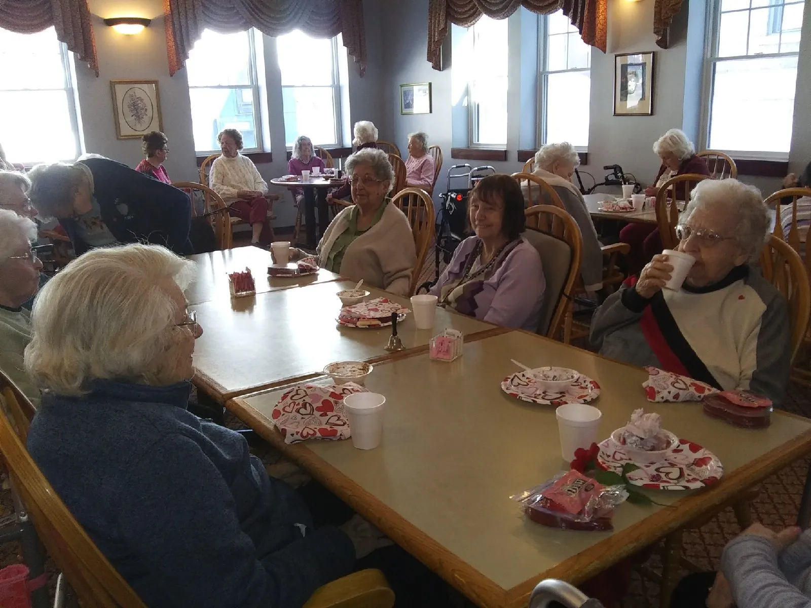 Residents enjoying snacks in a dining room