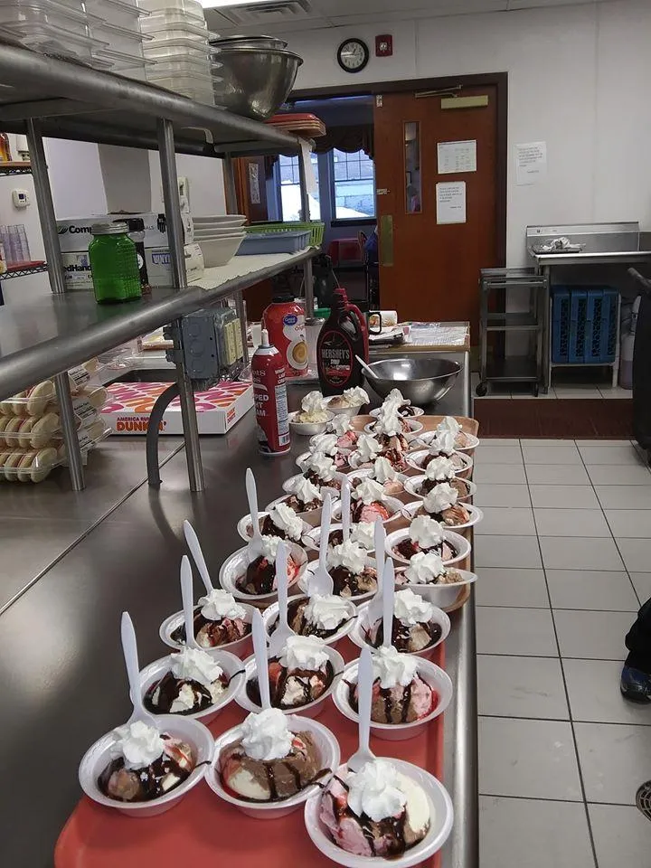 Bowls of ice cream topped with whipped cream