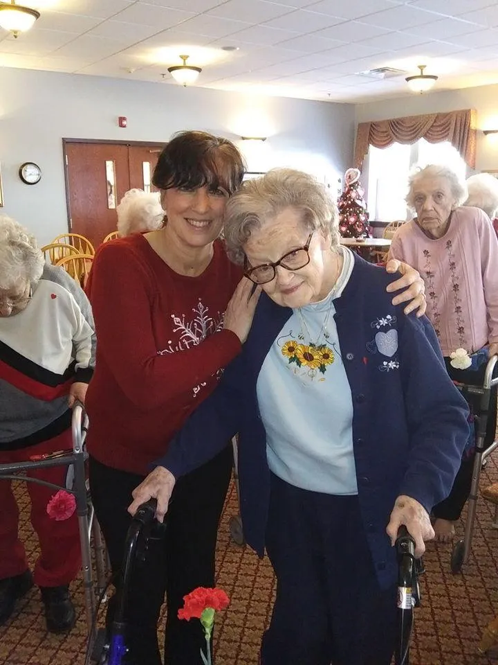 Residents engaging in a warm interaction in a common area