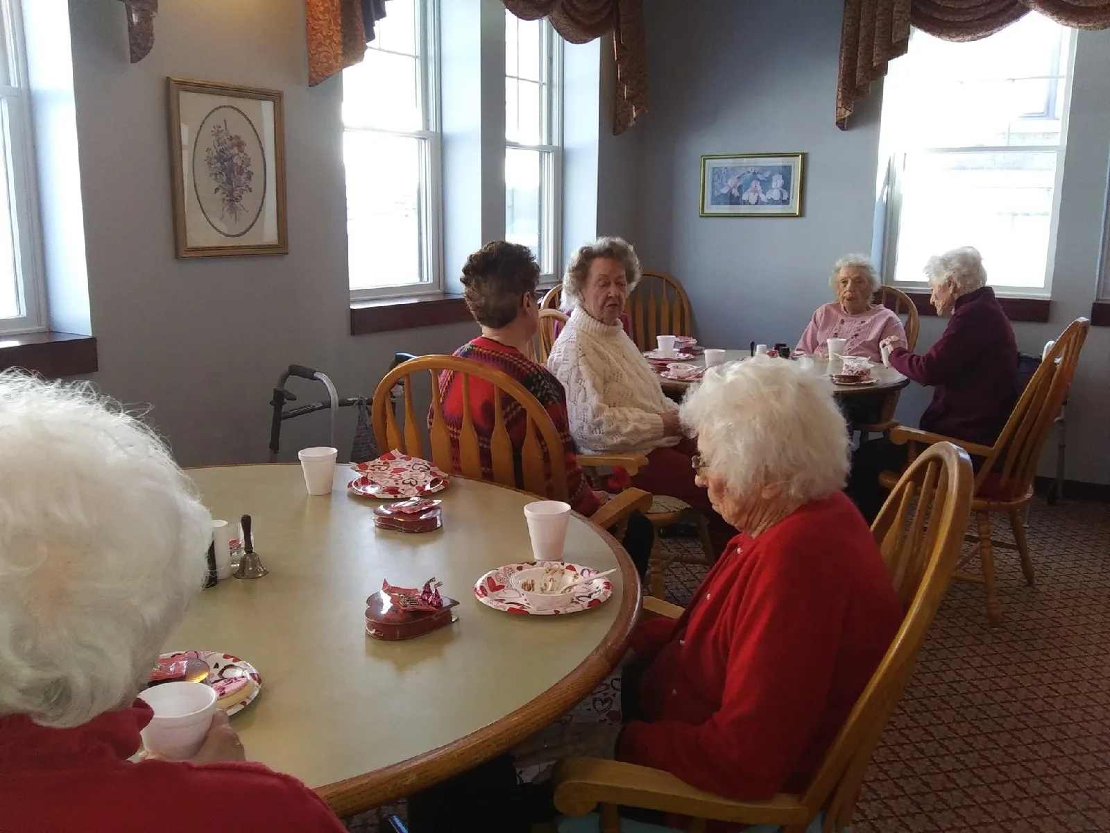 Residents enjoying refreshments in a dining area