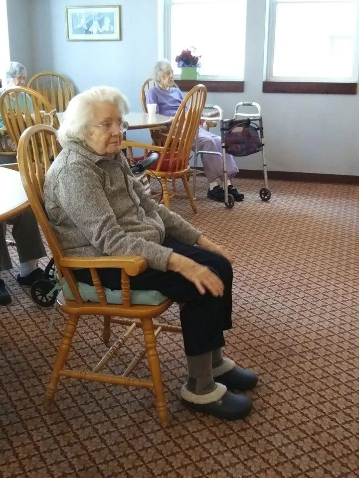 A resident sitting in an interior common area