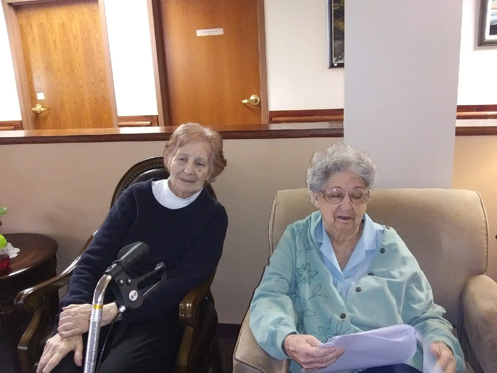 Two residents sitting in a common area