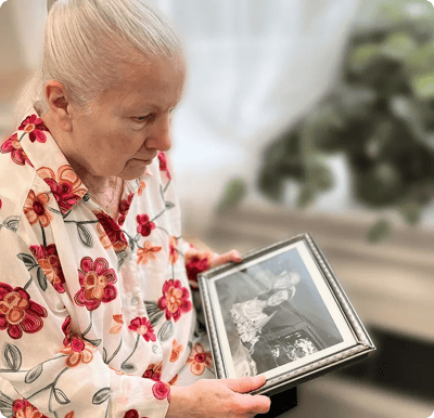 Resident looking at an old photograph with emotion