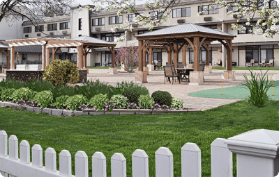 Well-maintained outdoor garden area with seating