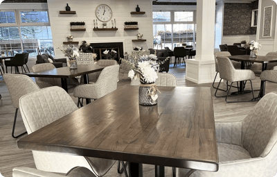 Stylish dining area with wooden tables and floral decor