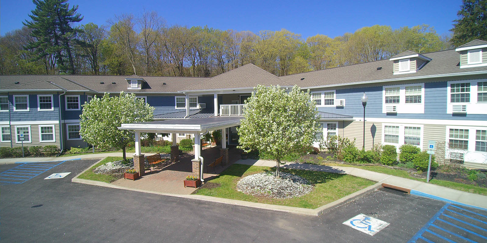 Exterior view of Mountain Valley Manor with landscaping
