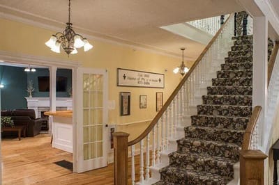 Staircase in a warmly lit facility interior
